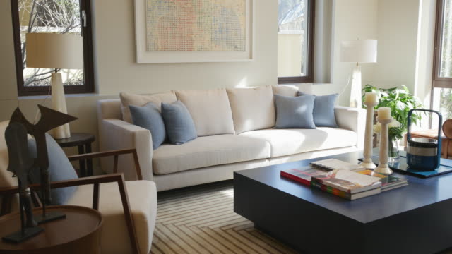 white sofa on decorated carpet in living room 4k